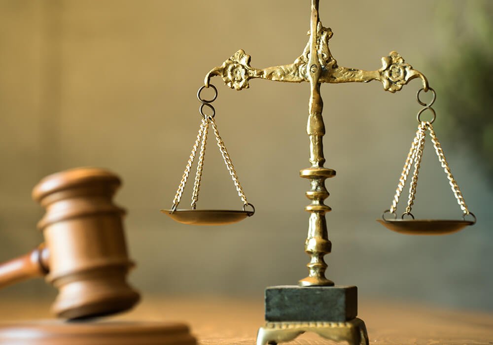 Image of a judge's gavel and a set of scales